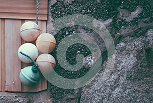 Fisherman buoys hanging against wall