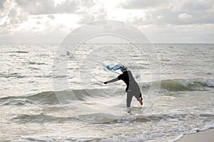 The fisherman cast a net the sea