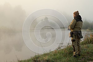 Fisherman catches fish on the lake