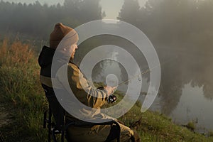 Fisherman catches fish on the lake