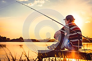 Fisherman caught fish. Caucasian man catch fish on lake. Angler on river fishing. fishing rod lake fisherman men sport