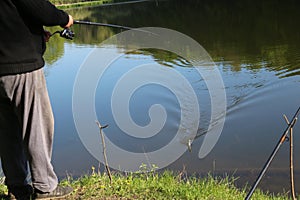 A fisherman caught a fish and hauls it ashore