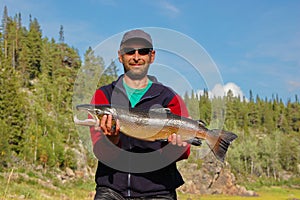 Fisherman caught a nice male salmon in the north river.