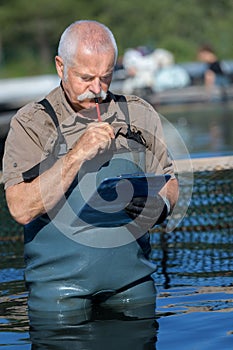fisherman checking clipboard