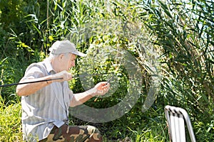 Fisherman checking his line, spinner and float