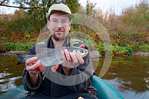 Fisherman with chub