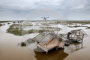 Fisherman cottage in swamp and square dip fish trap