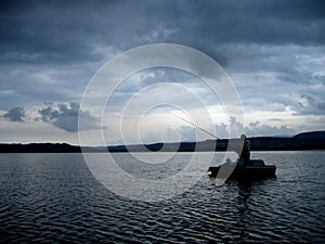 Fisherman on Dramatic Lake