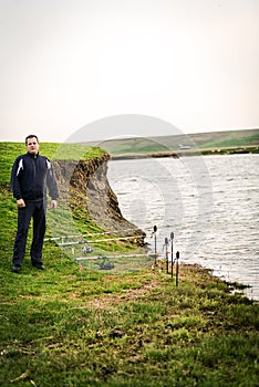 Fisherman at the edge of the lake upset