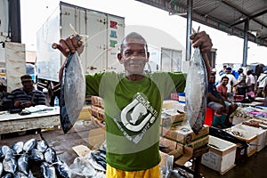 Fisherman, fish vendor. Fish market.