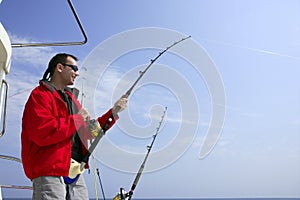 Fisherman fishing on boat big game tuna