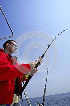 Fisherman fishing on boat big game tuna