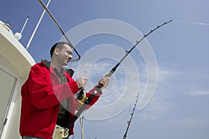 Fisherman fishing on boat big game tuna