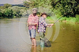 Fisherman fishing equipment. Fisherman grandpa and mature man friends. Father and son fishing. Fisherman family. Hobby