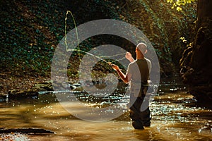 A fisherman fishing with fly fishing