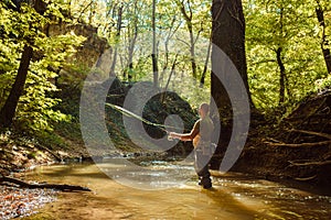 A fisherman fishing with fly fishing