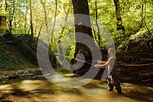 A fisherman fishing with fly fishing