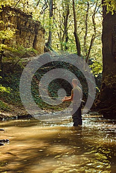 A fisherman fishing with fly fishing