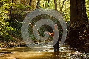 A fisherman fishing with fly fishing