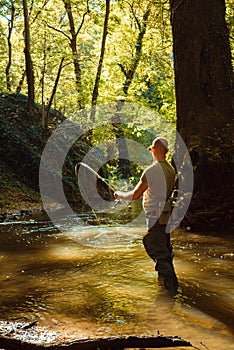 A fisherman fishing with fly fishing