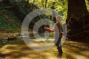 A fisherman fishing with fly fishing