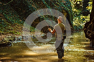 A fisherman fishing with fly fishing