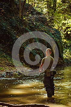 A fisherman fishing with fly fishing