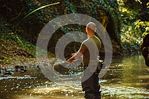 A fisherman fishing with fly fishing