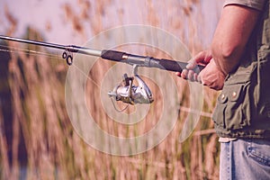 Fisherman fishing- Fisherman holding fishing rod