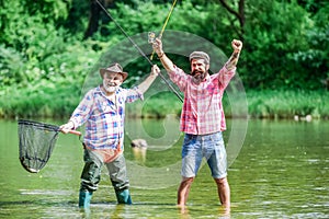 Fisherman with fishing rod. Activity and hobby. Fishing freshwater lake pond river. Bearded men catching fish. Master