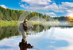 A fisherman is fishing in the Volga River. Russia, summer