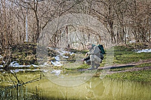 Fisherman fishing by the water in the winter.