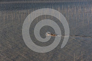 A fisherman going through the coastal intertidal zone of Xiapu