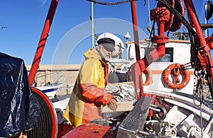 a fisherman in the harbor