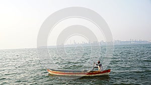 A fisherman in his boat at Arabian sea, Mumbai