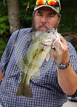 Fisherman holding Bass closeup