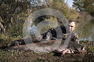 Fisherman holding a giant catfish.