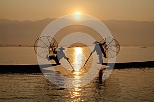 Fisherman of Inle Lake in action when fishing