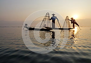 Fisherman of Inle Lake in action when fishing
