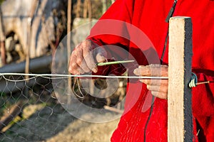 Fisherman knits fishing nets