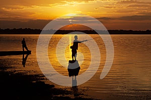 Fisherman of Lake in action when fishing, Thailand