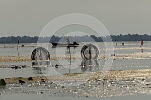 Fisherman on the lake puting the straps