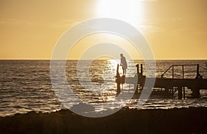 Fisherman on the pier at sunset in Bayahibe 5