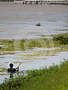 The Fisherman Prepared to Shooting with Harpoon Gun