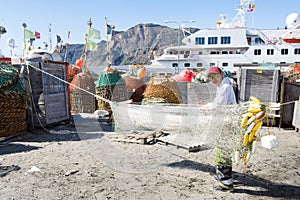 Greenlandic fisherman preparing nets