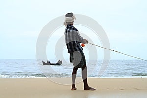 Fisherman pulls his fishing boat