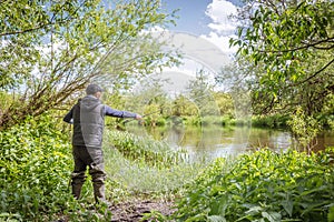 Fisherman on the river bank