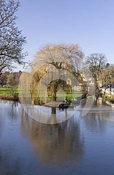 Fisherman on the river welland in the beautiful Lincolnshire town of stamford, portrait view.