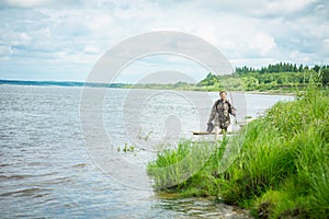 fisherman on the riverbank, selective focus