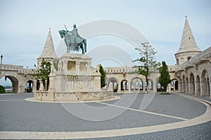 Fisherman`s Bastion and the statue of Stephen I. of Hungary and Matthias Church photo